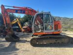 Escavatore cingolato FIAT KOBELCO E115SR usato 2003 con girosagoma, lama e impianto martello