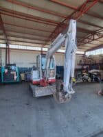 Front view of used 2002 Takeuchi TB135 mini excavator for sale in Rome, Italy