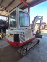 Rear view of used 2002 Takeuchi TB135 mini excavator for sale in Rome, Italy