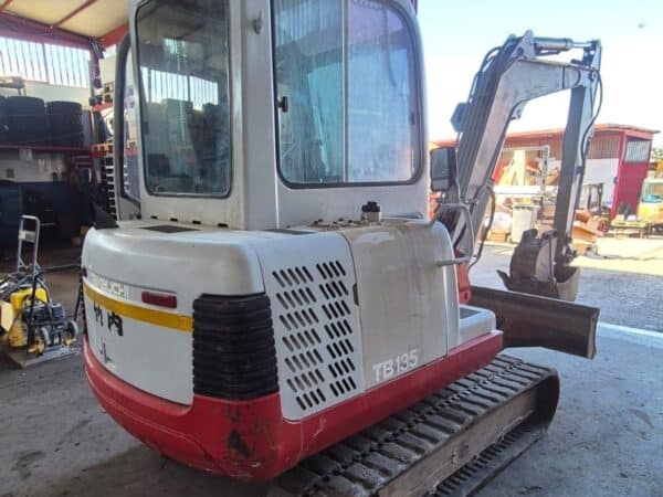 Rear view of used 2002 Takeuchi TB135 mini excavator for sale in Rome, Italy