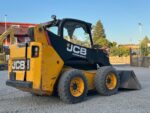 Vista laterale minipala gommata JCB 225 del 2012 in vendita da DAMAC