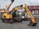 CATERPILLAR 311CU monolitico cingoli in ferro vista frontale