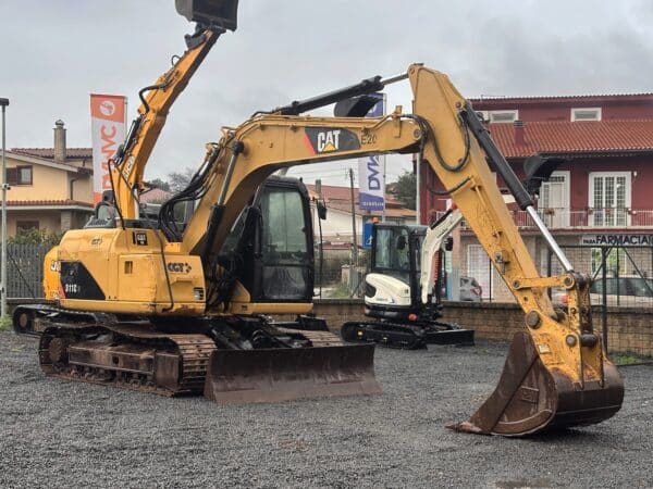 Home 8 CATERPILLAR 311CU monolitico cingoli in ferro vista frontale