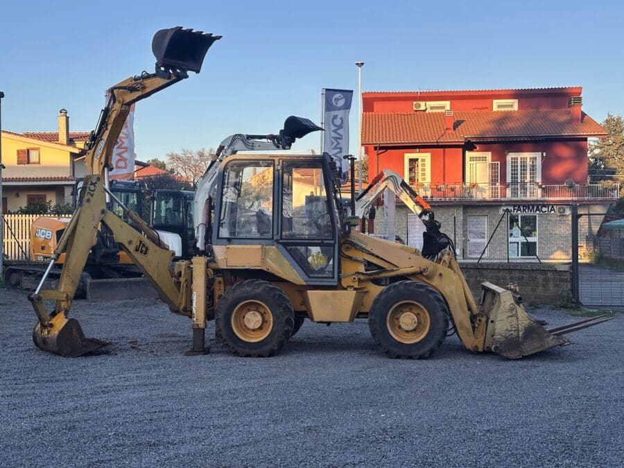 Compact JCB 2CX backhoe loader with enclosed cab at DAMAC