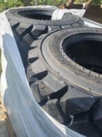 New Malhotra 10-16.5 skid steer tires on pallet