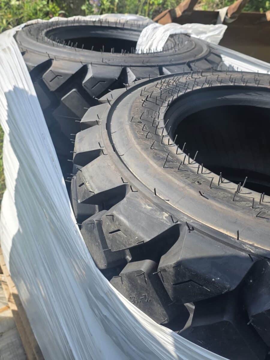 New Malhotra 10-16.5 skid steer tires on pallet