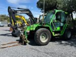 Used Merlo P34.10 on yard with forks mounted